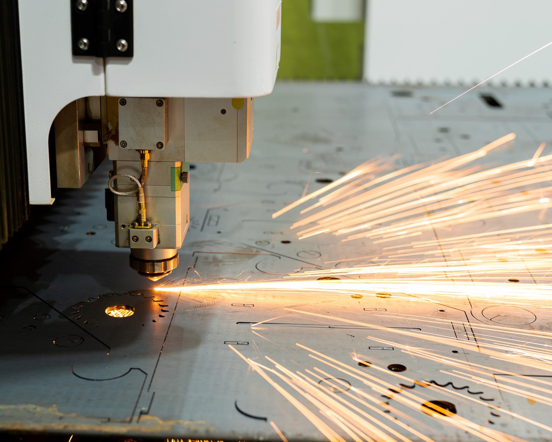 CNC machine. Laser cutting of metal. Sparks.